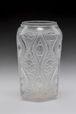 a clear glass jar with a design on it