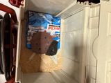 a toy truck that is sitting inside of a box