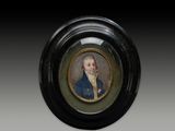 an oval miniature portrait of a gentleman in a blue coat