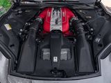 a red engine in the hood of a car