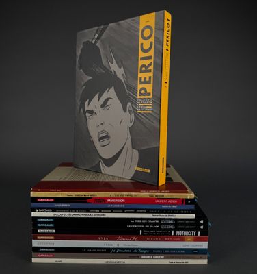 books stacked on top of each other on a gray surface