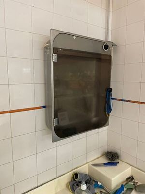 a sink in a bathroom with a mirror above it
