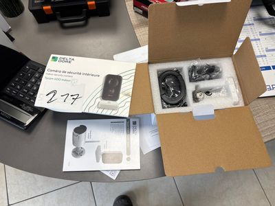 a box with a cell phone inside of it on a table