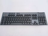 a black computer keyboard sitting on a white surface