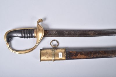 an old sword with a brass handle and a wooden handle