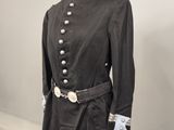 an image of a black uniform on a mannequin stand