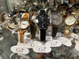 a lot of watches on display in a glass case
