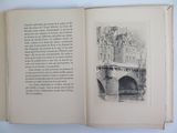 an open book with a drawing of a bridge in it