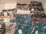 several pairs of underwear are wrapped in plastic bags on a shelf
