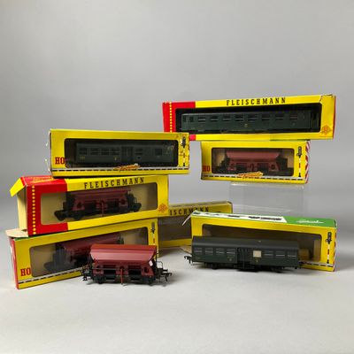 three boxed trains are sitting on a table next to each other