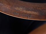 a close up of a wooden chair with a name engraved on it