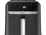 a close up of an air fryer on a white background
