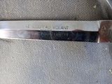 a knife that is laying on a chair