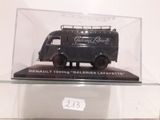 a black van in a glass case on a shelf
