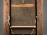 an old wooden easel with a rope around it on a gray background