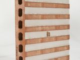 a close up of a piece of wood with holes in it