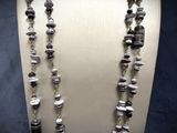 a close up of a necklace on a mannequin mannequin