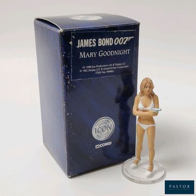 a figurine of a woman in a bikini standing next to a box