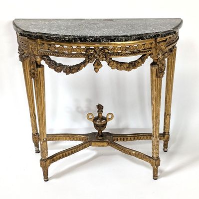 a small table with a marble top and a vase on it