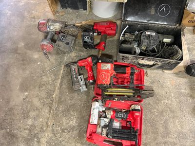many tools that are sitting on the floor in the garage