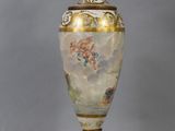 a lamp that is sitting on a table with a chain