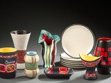 many different types of vases and plates on the table