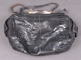 an image of a black purse with a snake skin pattern