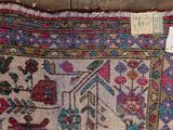 a rug on display on the floor with a price tag on it
