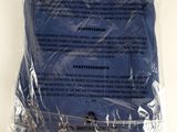 a plastic bag with a blue t - shirt inside of it