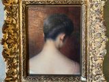 painting of a woman ' s back in a gold frame on a wall
