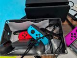 two nintendo wii controllers sitting in a box on a table
