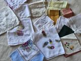 many different types of handkerchiefs laid out on a bed