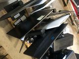 a pile of electronics that is sitting on top of a table