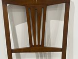 leather upholstered dining chair with a star design on the back