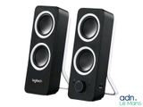pair of black speakers with white trims on a white background