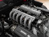 a close up of the engine of a red sports car