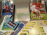 a lot of stamps and postcards on a table