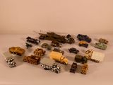 a lot of toy vehicles that are sitting on a table