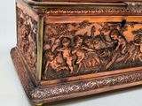 a box that has a painting on the inside of it