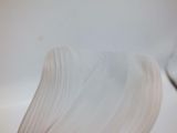 a close up picture of a white flower with a stem