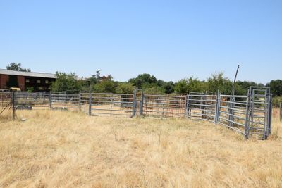 a fence that is in the middle of a field