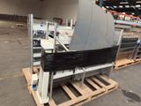 a machine that is sitting on a pallet in a warehouse