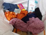 a bag full of clothes and other items in it