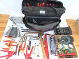 a bag of tools sitting on top of a table