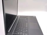 a laptop computer sitting on top of a white table