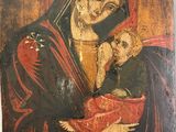 une peinture ancienne représentant une femme tenant un bébé dans ses bras
