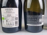 three bottles of wine sitting next to each other on a table