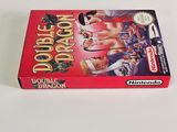 the box for the nintendo game double dragon is sitting on a white surface