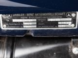 a close up of a mercedes emblem on the back of a motorcycle