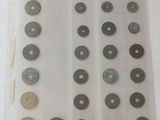 a lot of different types of coins on the table